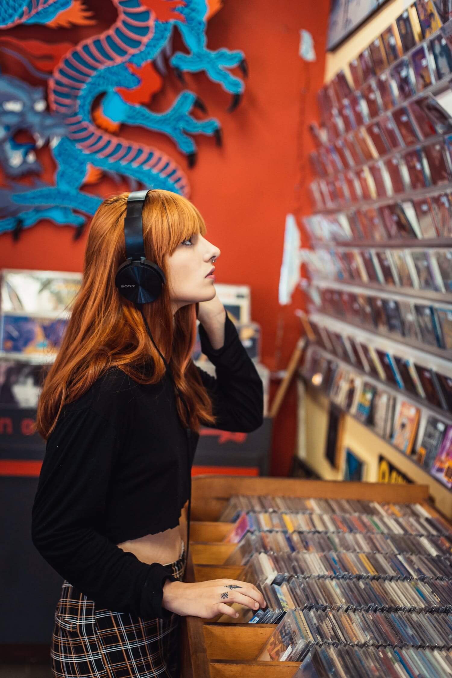 a person standing in front of a book shelf