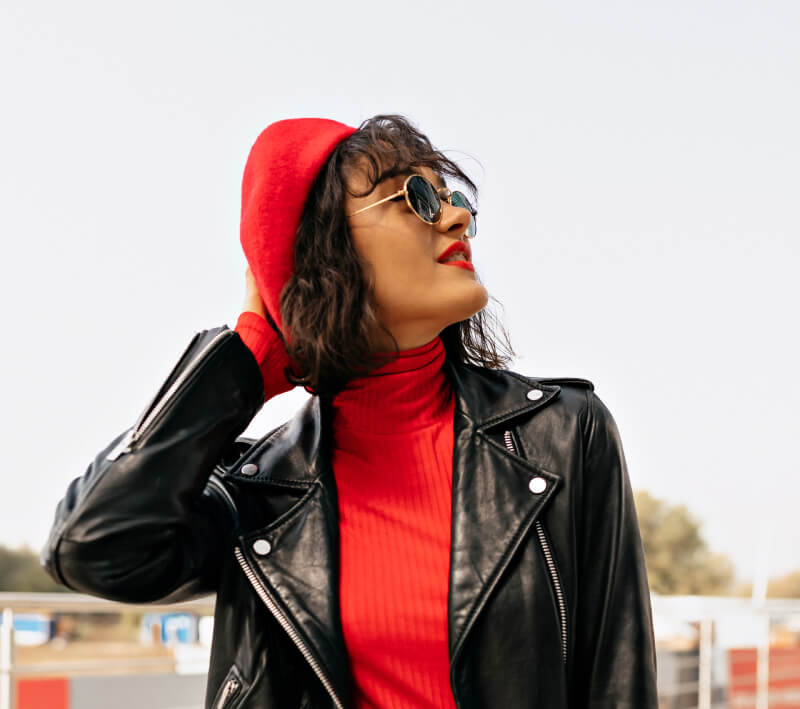 a person wearing a red hat and sunglasses